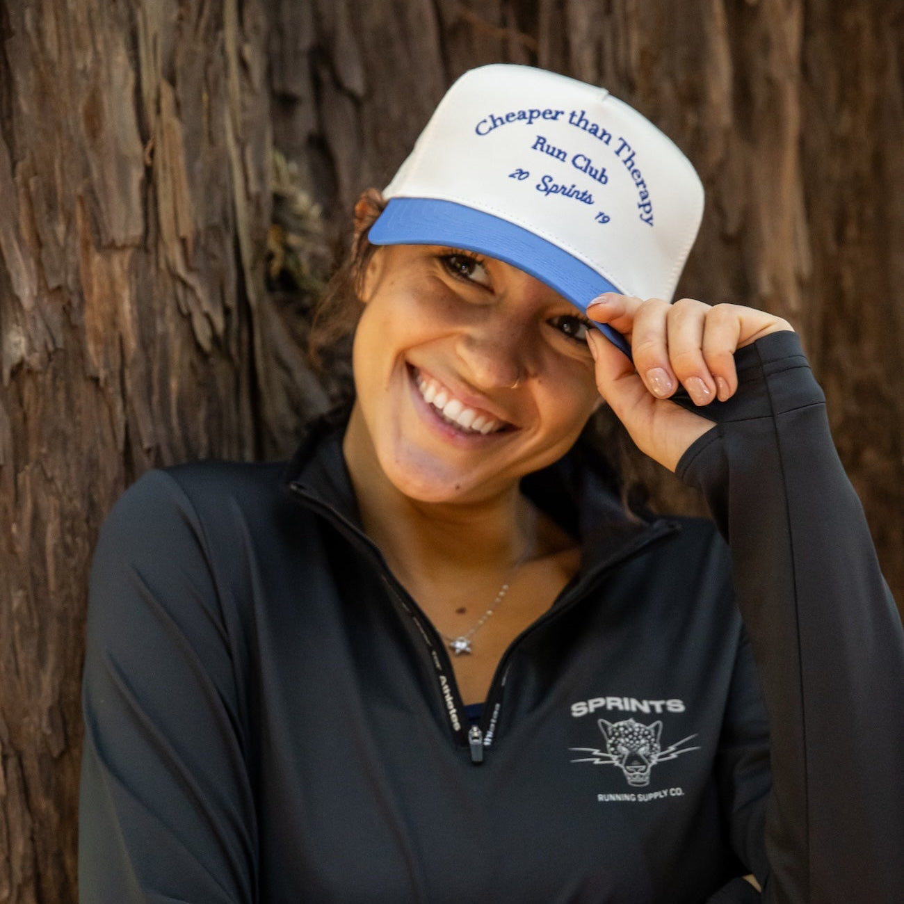 Runner wearing the Cheaper Than Therapy Run Club VP Hat