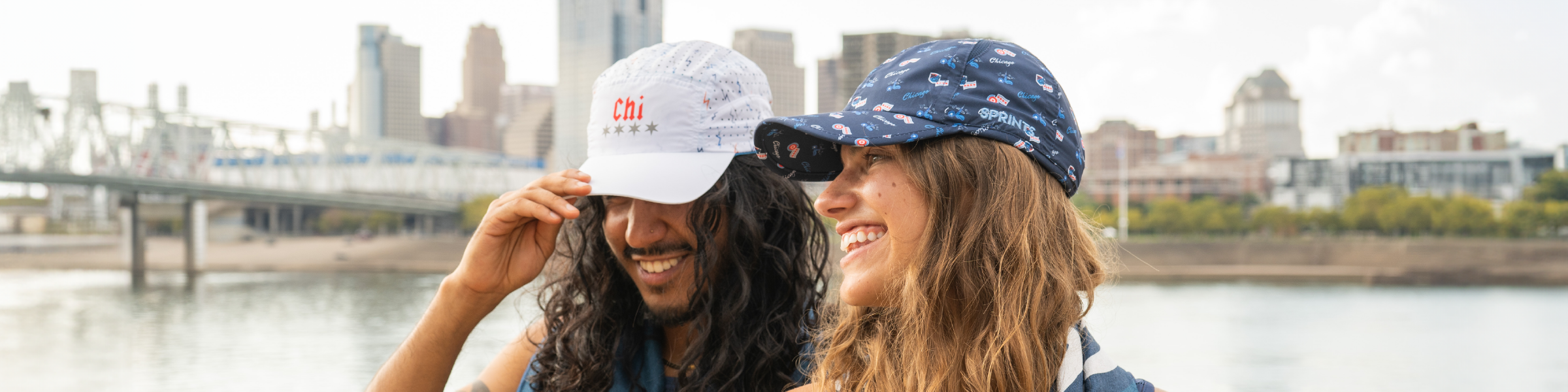 3 guys standing under a bridge wearing sunglasses and hats