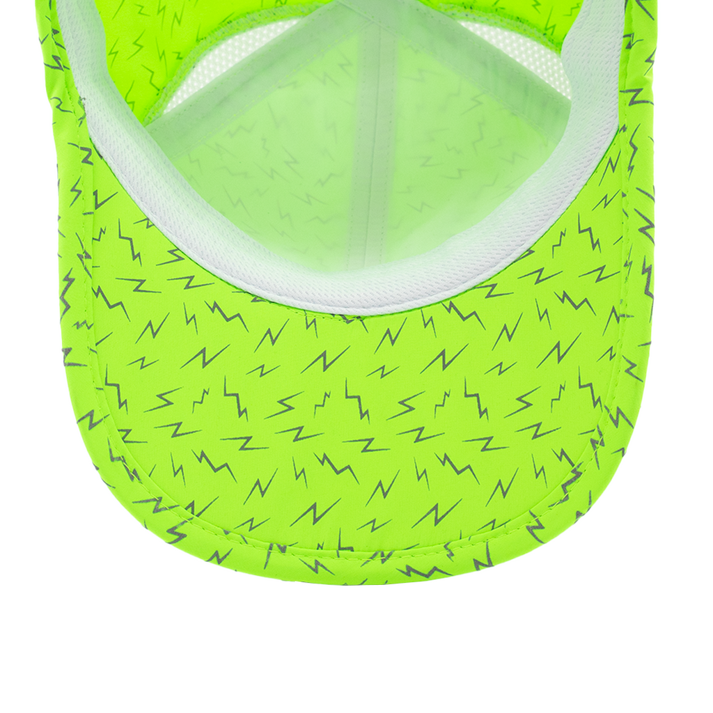 Underside of neon green hat with lightning bolts showing white sweatband